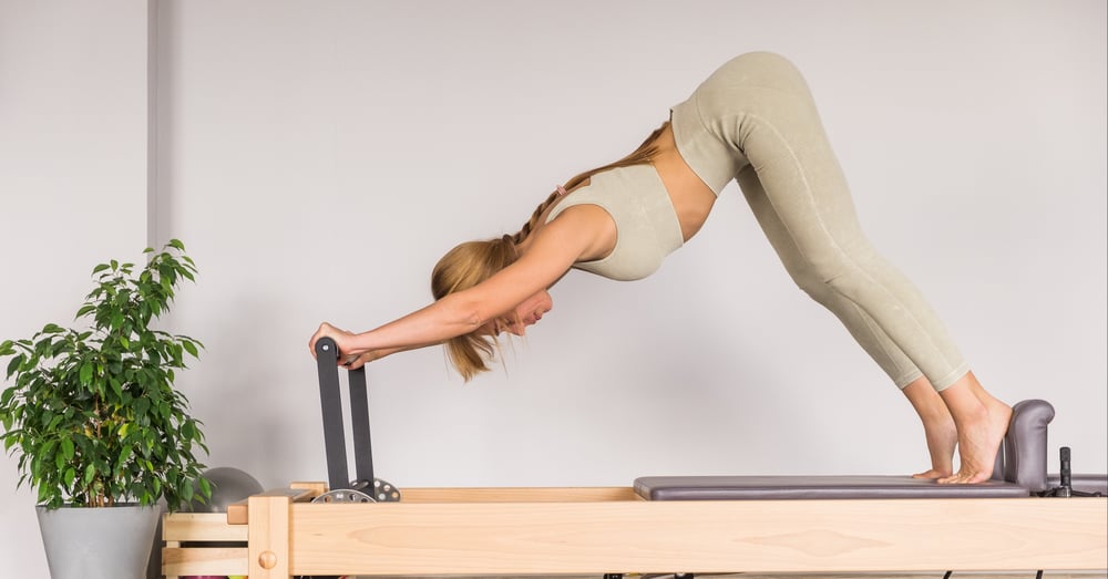 woman-training-pilates-on-the-reformer-bed-reform-2026-01-07-05-48-09-utc
